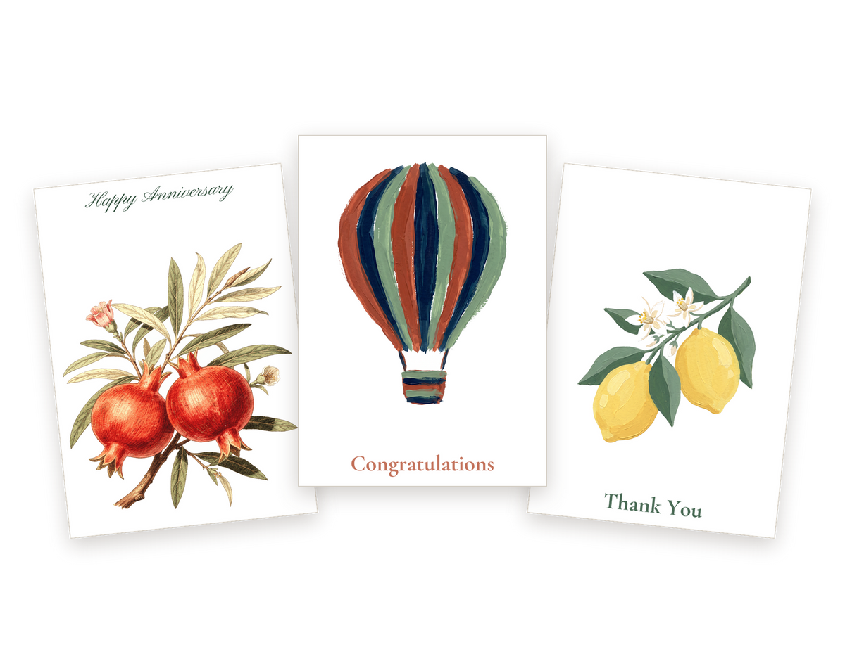Three WellSent cards: a Happy Anniversary pomegranate branch, a Congratulations hot air balloon and a Thank You lemon branch